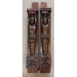 A pair of 17th century carved oak herms,