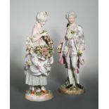 A pair of 19th century German porcelain figurines,