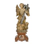 A Spanish carved wood figure of St Michael, 17th century,