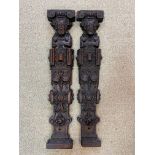 Two similar carved oak herms,