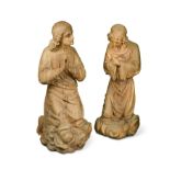 An imposing pair of carved kneeling female figures, possibly limewood and early 18th century,