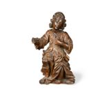A carved figure of a kneeling male, probably late 17th or early 18th century,