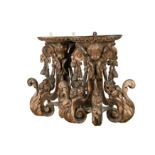A pair of 17th century carved limewood wall brackets,