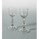 A pair of George III wine glasses,