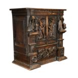 A North European carved oak cabinet of small proportions, late 17th or early 18th century,