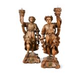 A pair of Continental carved limewood pricket stands, 17th century,