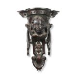 A pair of 17th century style carved and stained wall brackets, 20th century,