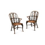 A pair of yew and mahogany gothic Windsor armchairs, mid 18th century,