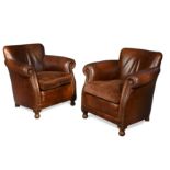 A pair of leather club arm chairs, modern,