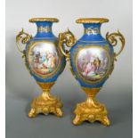 A pair of French porcelain, two-handled ormolu mounted vases, probably Sevres,