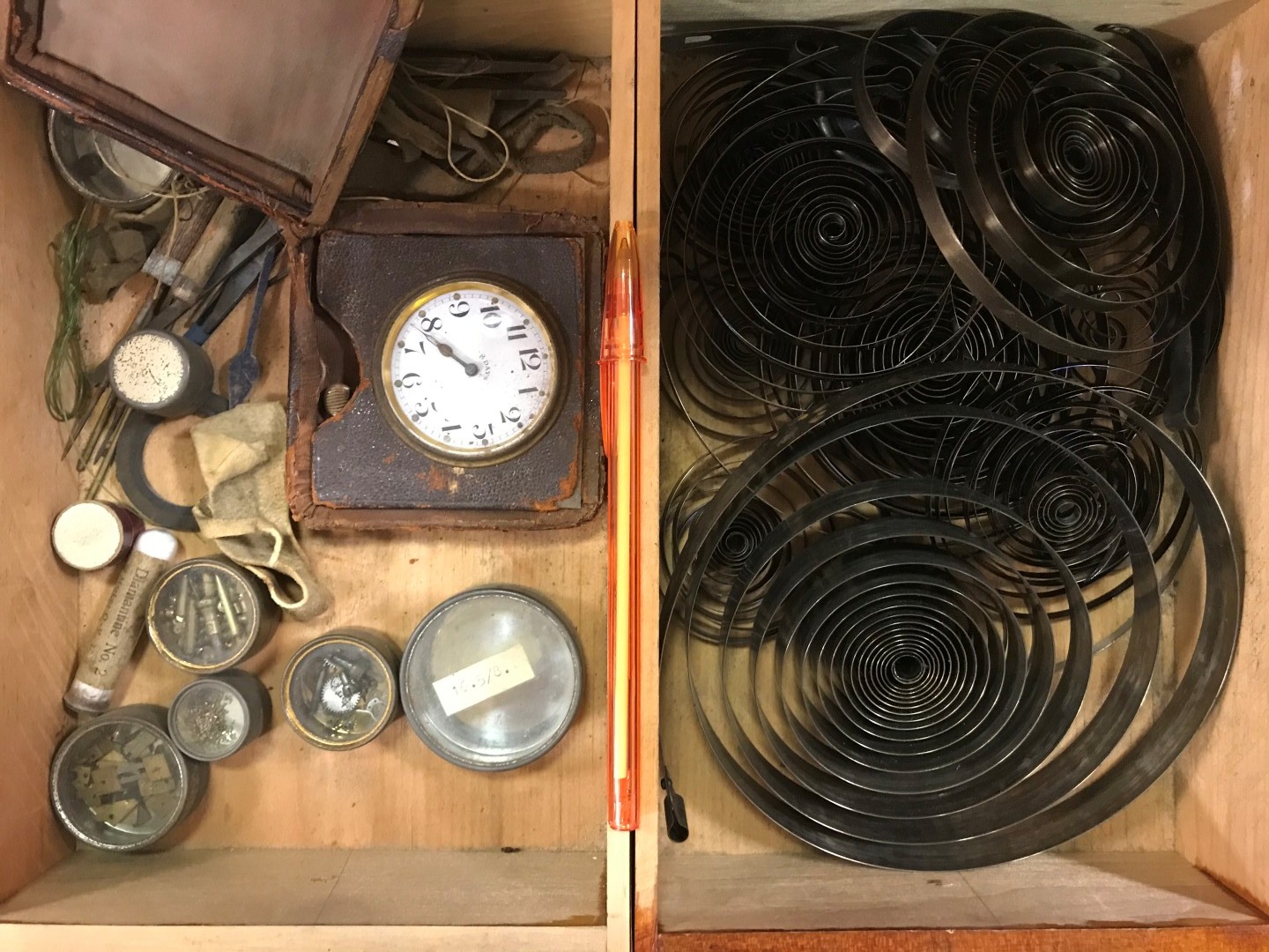 A cabinet of watchmaker's spare parts, watch movements, tools and oddments, circa 1900, the two - Image 8 of 9