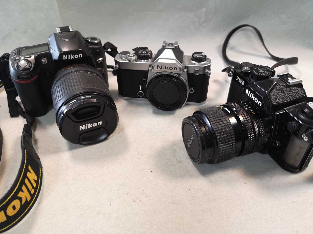 A collection of Nikon 35mm cameras and lenses,
