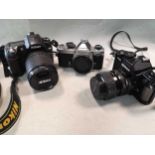 A collection of Nikon 35mm cameras and lenses,