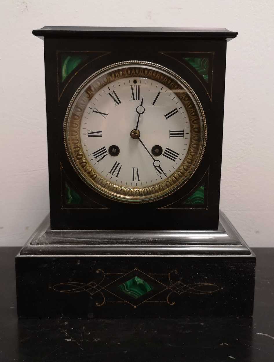 A late Victorian black marble and malachite inlaid mantel clock,