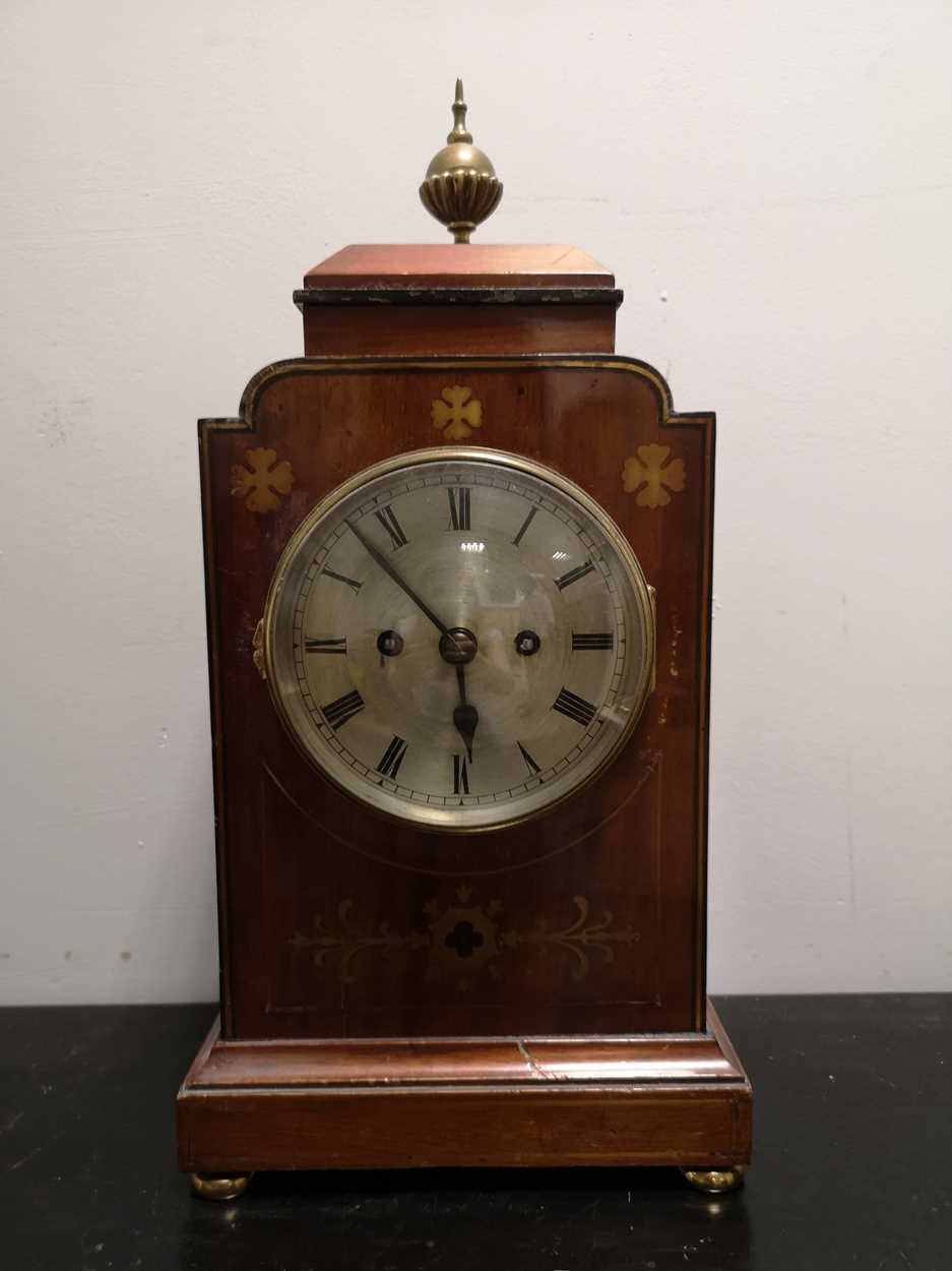 A mahogany and brass inlaid mantel clock circa 1900,