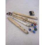 Miscellaneous objects of Vern including two named laced bobbins, bone, 19th century, a Persian