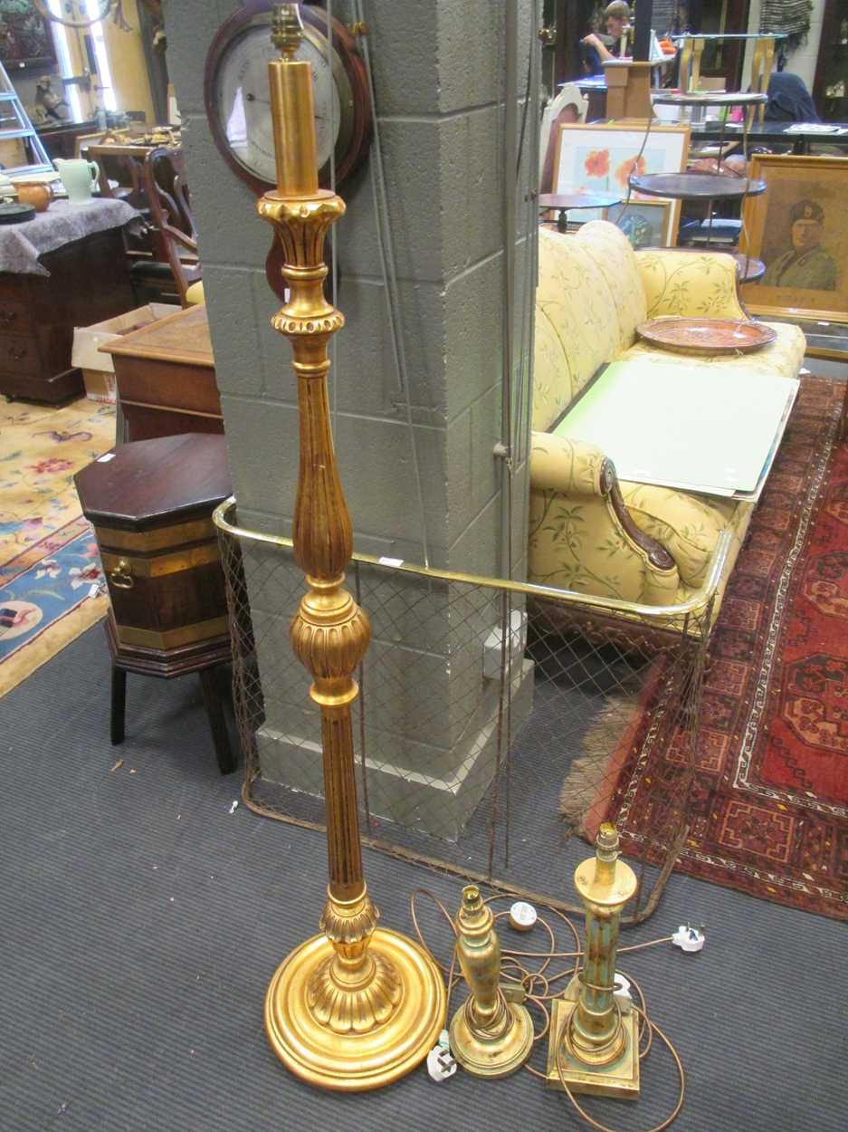 A gold painted standing lamp, two similar table lamp bases together with three mirrors (6)