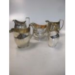 A collection of five silver milk jugs, 23.2ozt gross (5)