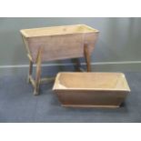 A 19th century elm dough bin on stand and another