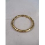 A slave bangle, tests to 18ct 30.7g
