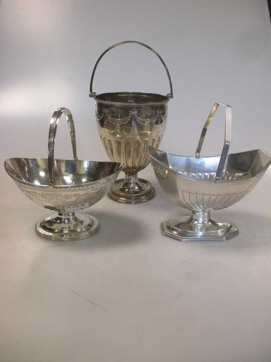 Three Victorian silver swing handled sugar baskets, 13.9ozt gross (3)