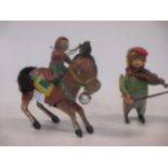 A Schuco tinplate clockwork monkey violinist and a tinplate donkey (2)