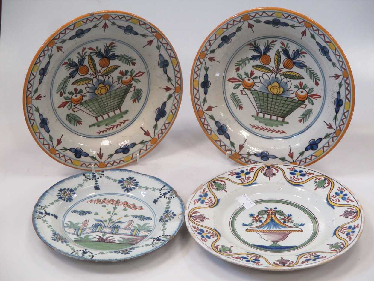 A pair of Continental tin glazed dishes and two Delft plates (4)