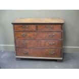 An 18th century walnut chest of drawers, the cross banded top above two short and three long