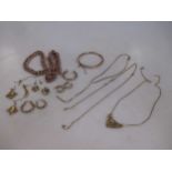 Two 'charm' style bracelets marked '9ct' together with a quantity of scrap 9ct gold and a bangle,