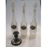Three 19th century Bohemian white overlay glass decanters with labels together with a pietra dura