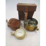 A cased galvanometer together with a military issue cased pocket barometer (2)