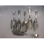 Five George III silver fish servers together with a Victorian example 25.8ozt gross (6)