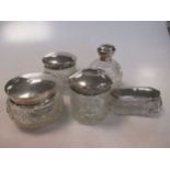 A collection of 5 silver topped glass dressing table jars (5)