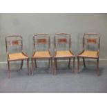 A set of four Regency mahogany dining chairs the backs inlaid with ebony with Athenaeum, caned