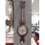 J Ronchetti, Exeter, an early 19th century mahogany & inlaid banjo barometer.