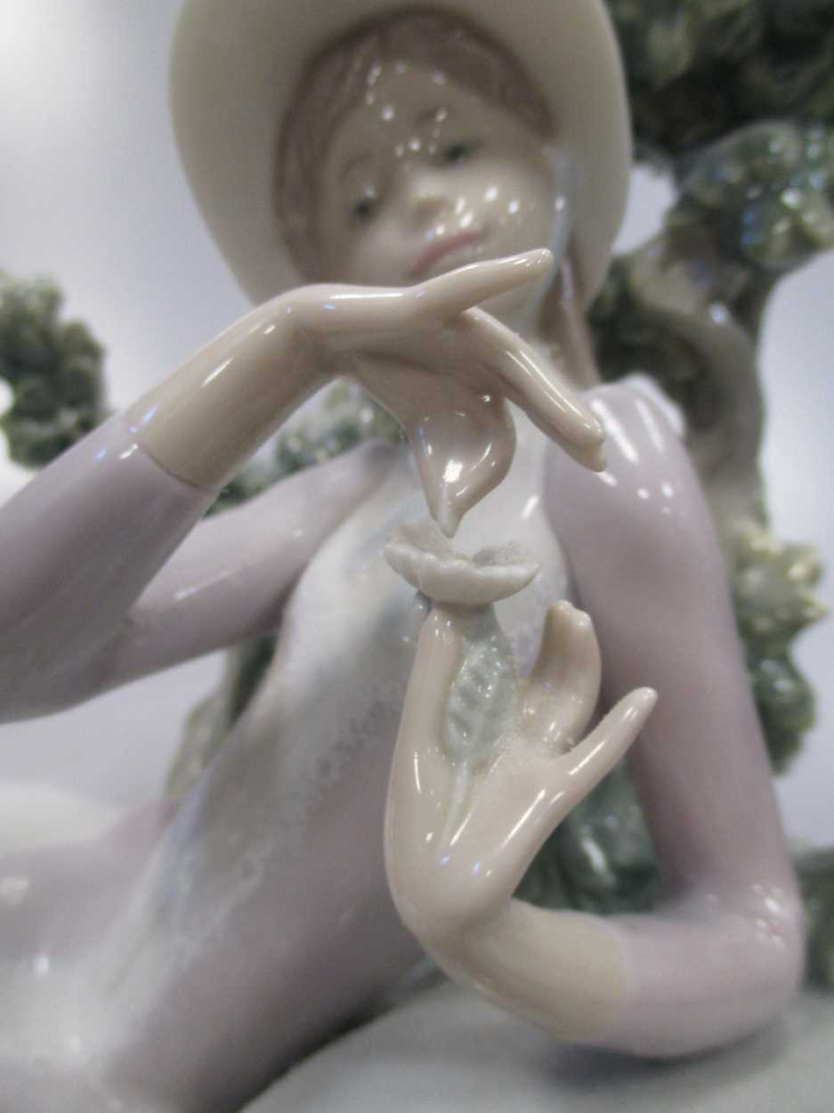 A Lladro figure of a lady reclining besides a tree - Image 6 of 7