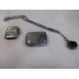 Two silver vesta cases together with a pocket watch chain and fob (3)