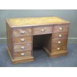 An ask and oak twin pedestal desk, early 20th century, 122cm wide