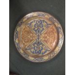 A Hispano Moresque bowl pink lustre circular dish, 46cm (slight damage)