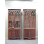 A pair of 19th century Irish mahogany bookcases, with lancet arched glazed doors, 240 x 105 x