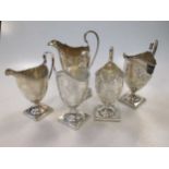 A collection of 5 Georgian silver helmet style cream jugs, one loaded, 13.8ozt weighable silver (5)