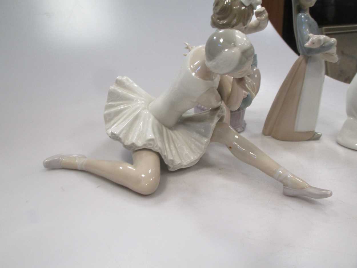 Four Lladro figures, to include a Ballerina, a girl holding a pig etc - Image 3 of 9