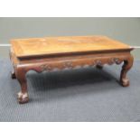 A Chinese hardwood low table on claw and ball feet, 30 x 83 x 45cm