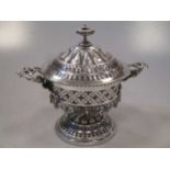A silver plated pierced and covered sweet meat jar