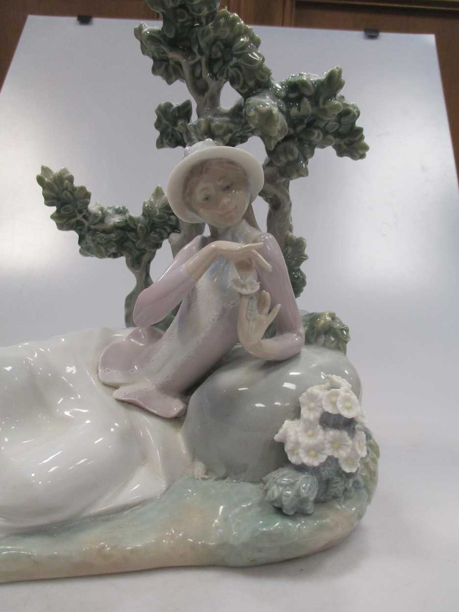 A Lladro figure of a lady reclining besides a tree - Image 4 of 7