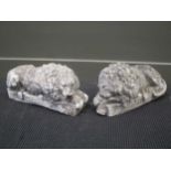 A pair of 19th century plaster recumbent lions