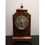A mahogany and brass inlaid mantel clock circa 1900,
