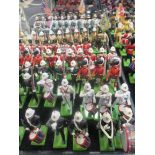 A collection of modern mostly Britains lead soldiers, many re-touched or re-painted