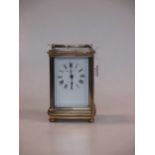 A small French brass carriage timepiece,