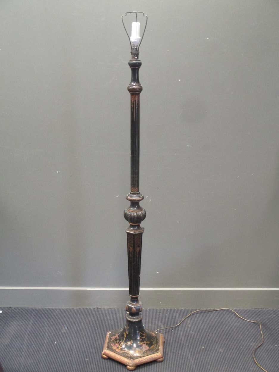 A black lacquered and gilt standard lamp